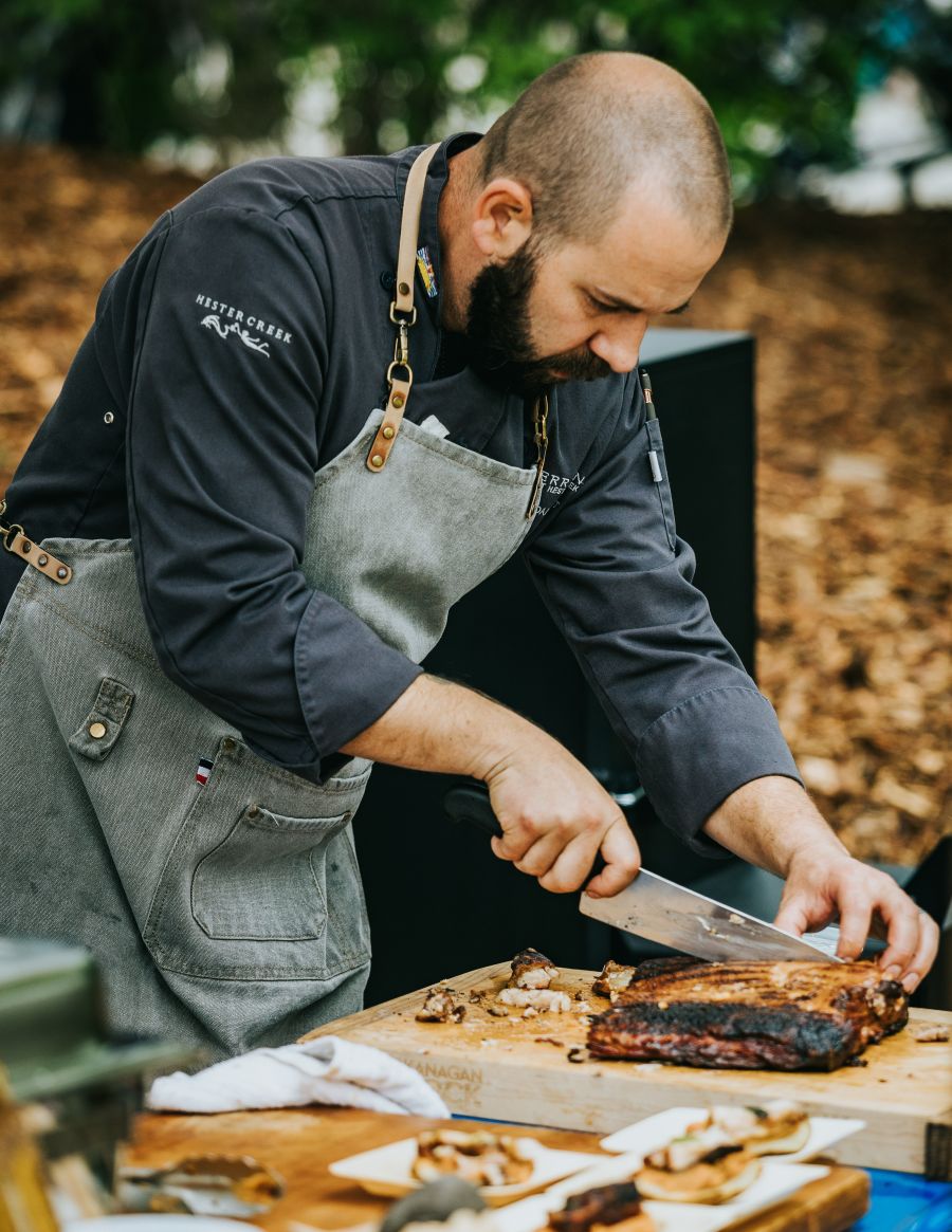 <who>Photo credits: Aaron Hagen</who>Cutting ribs at Pig Out.